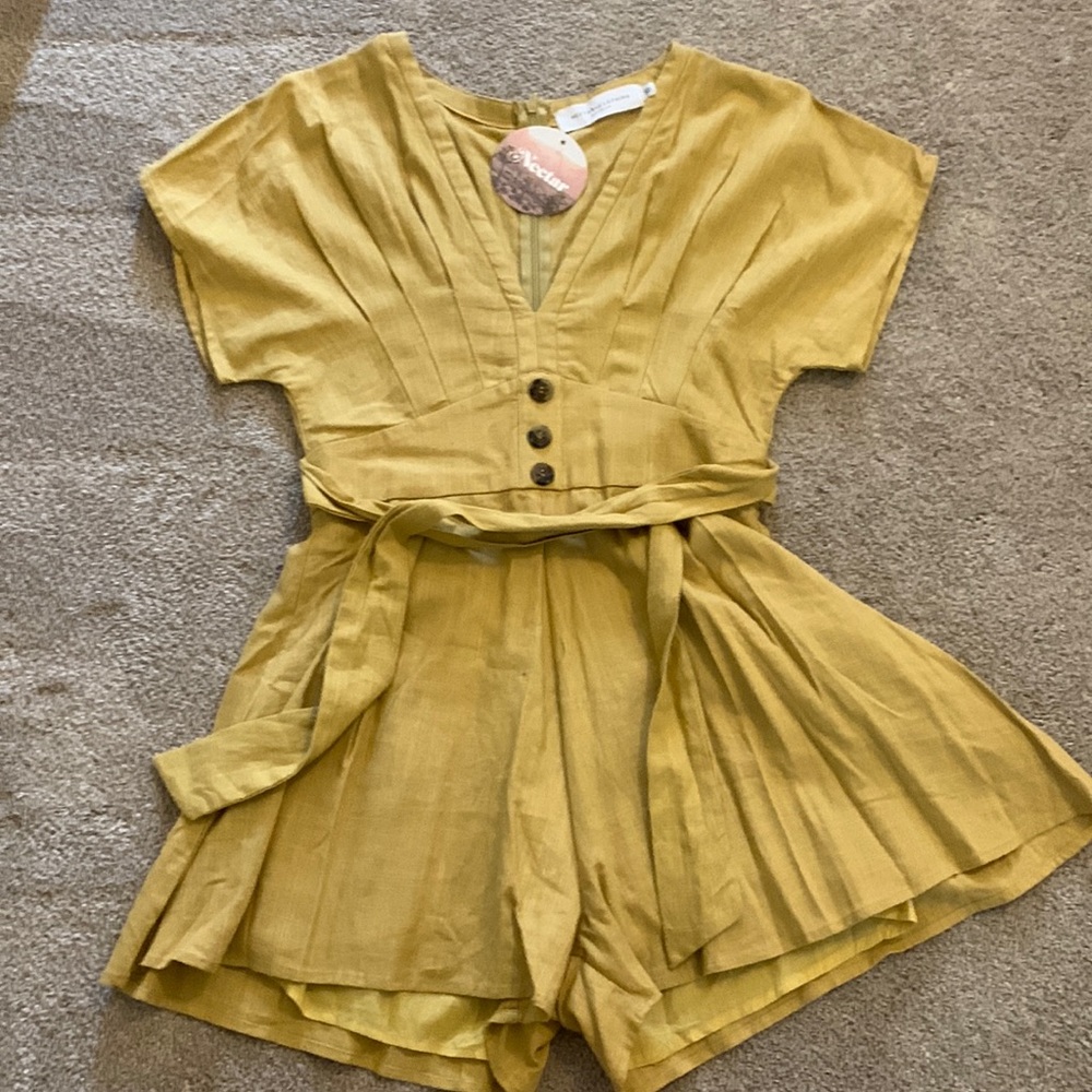 New with tags on Nextar mustard romper size small